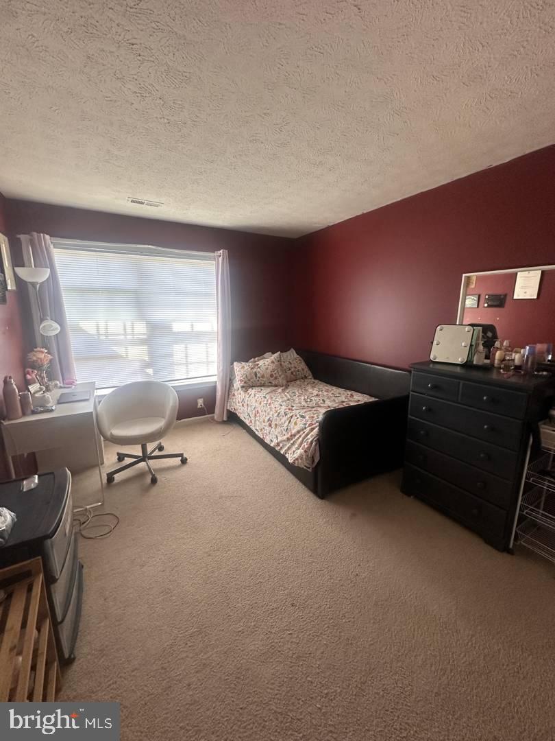 35391 Pheasant Ridge Road Locust Grove, VA 22508 - Photo 16 of 16 a bedroom with a bed and a window