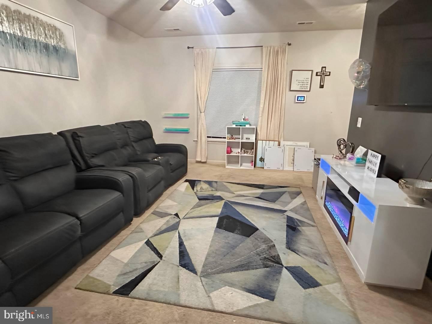 35391 Pheasant Ridge Road Locust Grove, VA 22508 - Photo 4 of 16 a living room with furniture and a flat screen tv