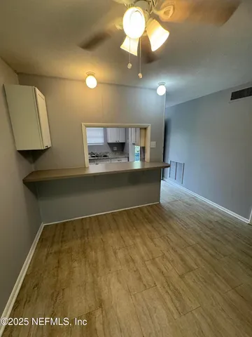 a view of an empty room with a window