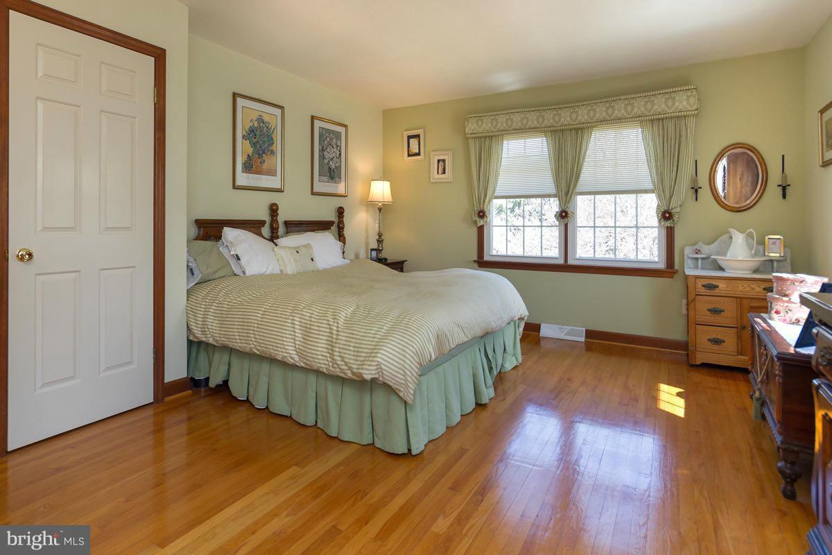 2807 Monkton Road Monkton, MD 21111 - Photo 19 of 30 a bedroom with a bed dresser and a window