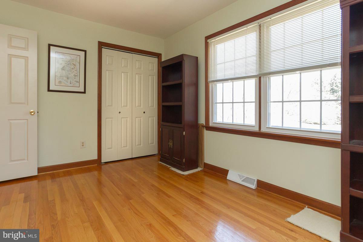 2807 Monkton Road Monkton, MD 21111 - Photo 22 of 30 a view of an empty room with wooden floor and a window