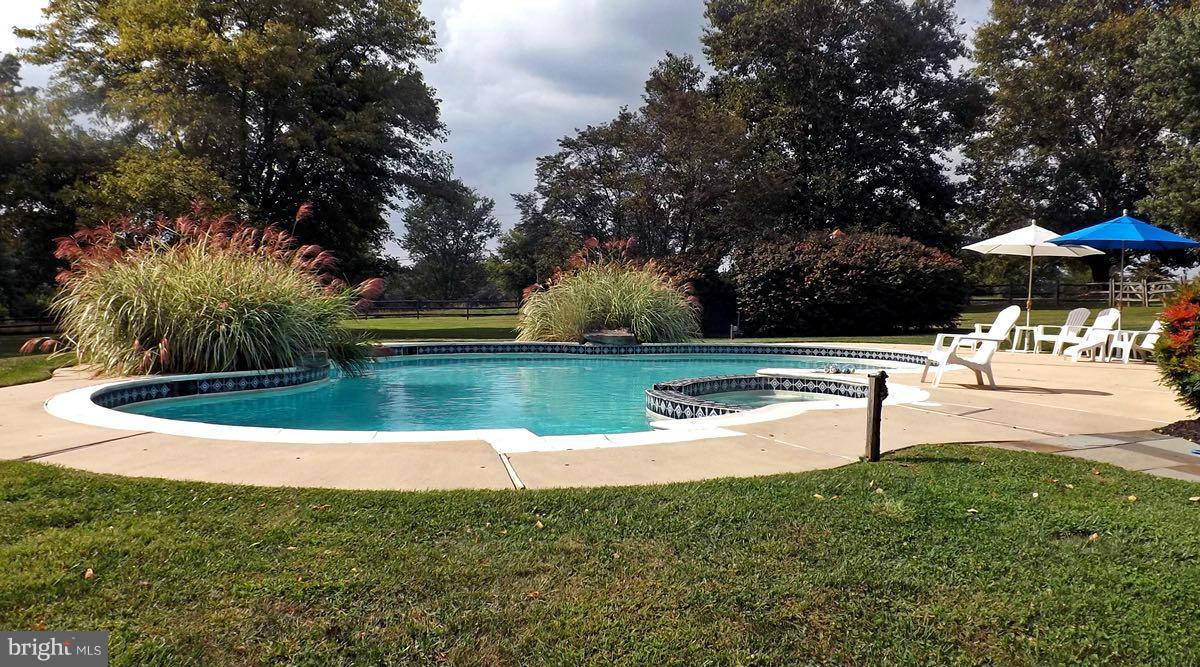 2807 Monkton Road Monkton, MD 21111 - Photo 27 of 30 a view of a swimming pool with a yard