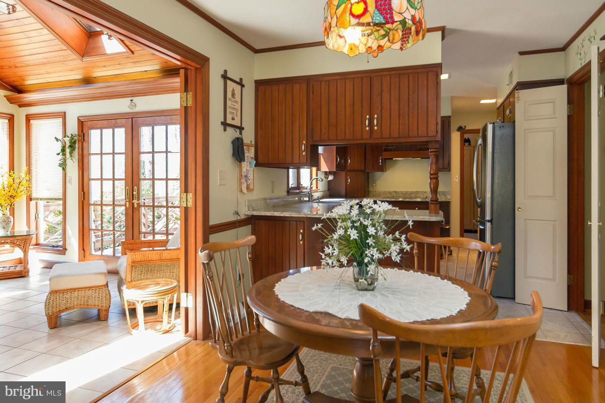 2807 Monkton Road Monkton, MD 21111 - Photo 4 of 30 a kitchen with a table chairs stove and refrigerator