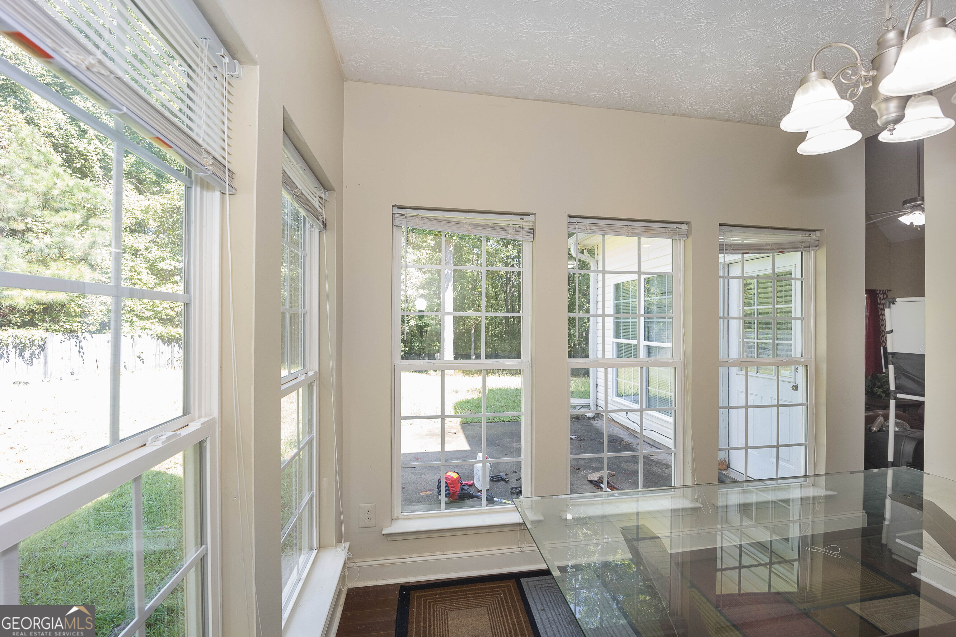 1231 Hillview Road Hampton, GA 30228 - Photo 12 of 45 a living room filled with furniture and large windows