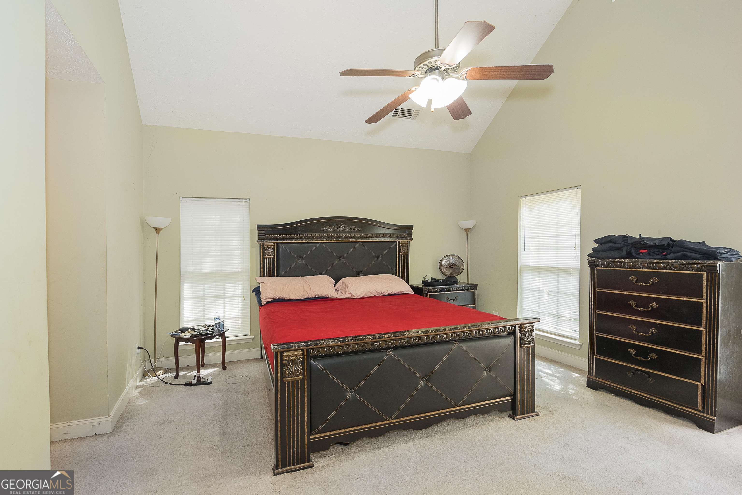 1231 Hillview Road Hampton, GA 30228 - Photo 20 of 45 a bedroom with a bed and a ceiling fan