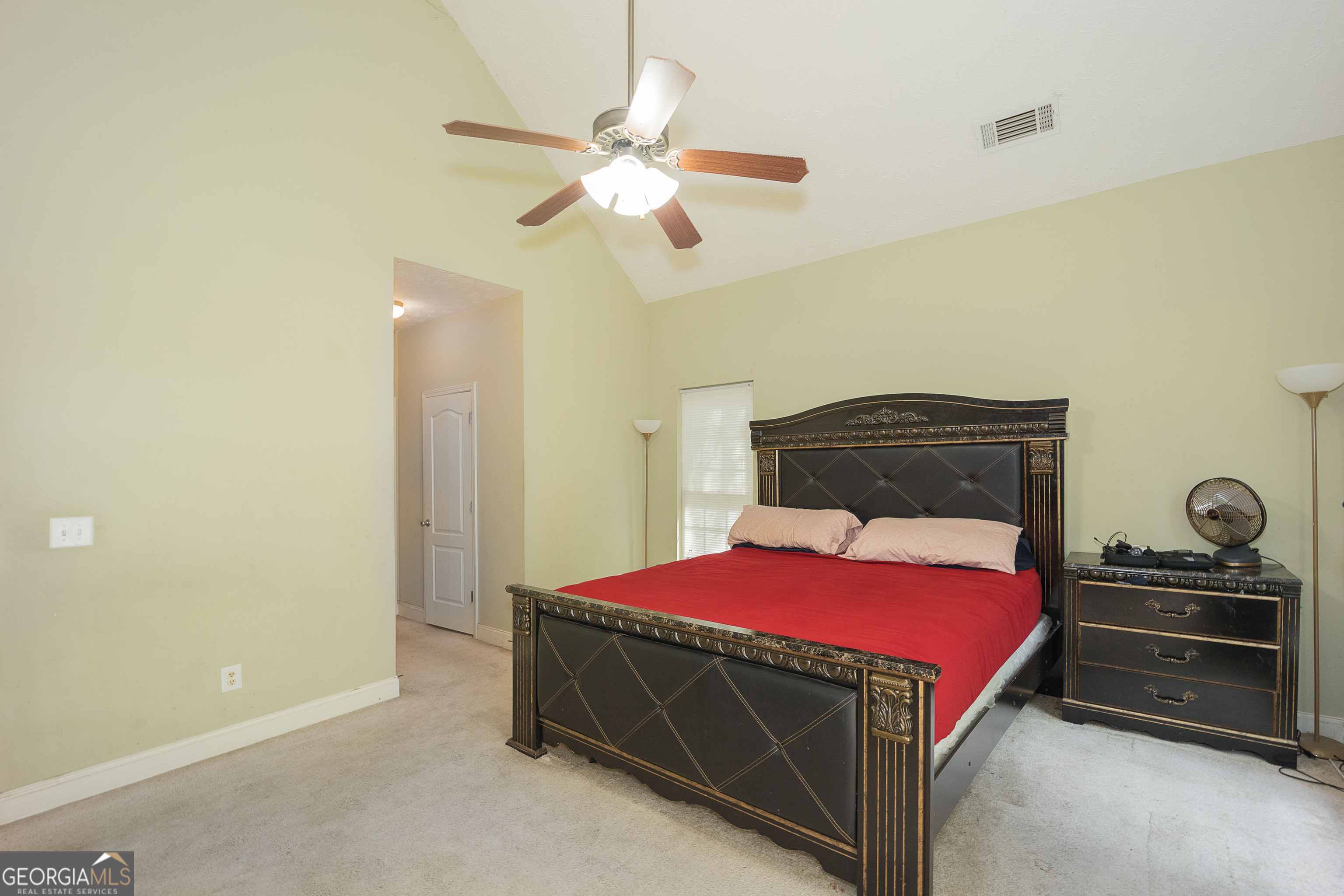 1231 Hillview Road Hampton, GA 30228 - Photo 21 of 45 a bedroom with a bed and a chandelier