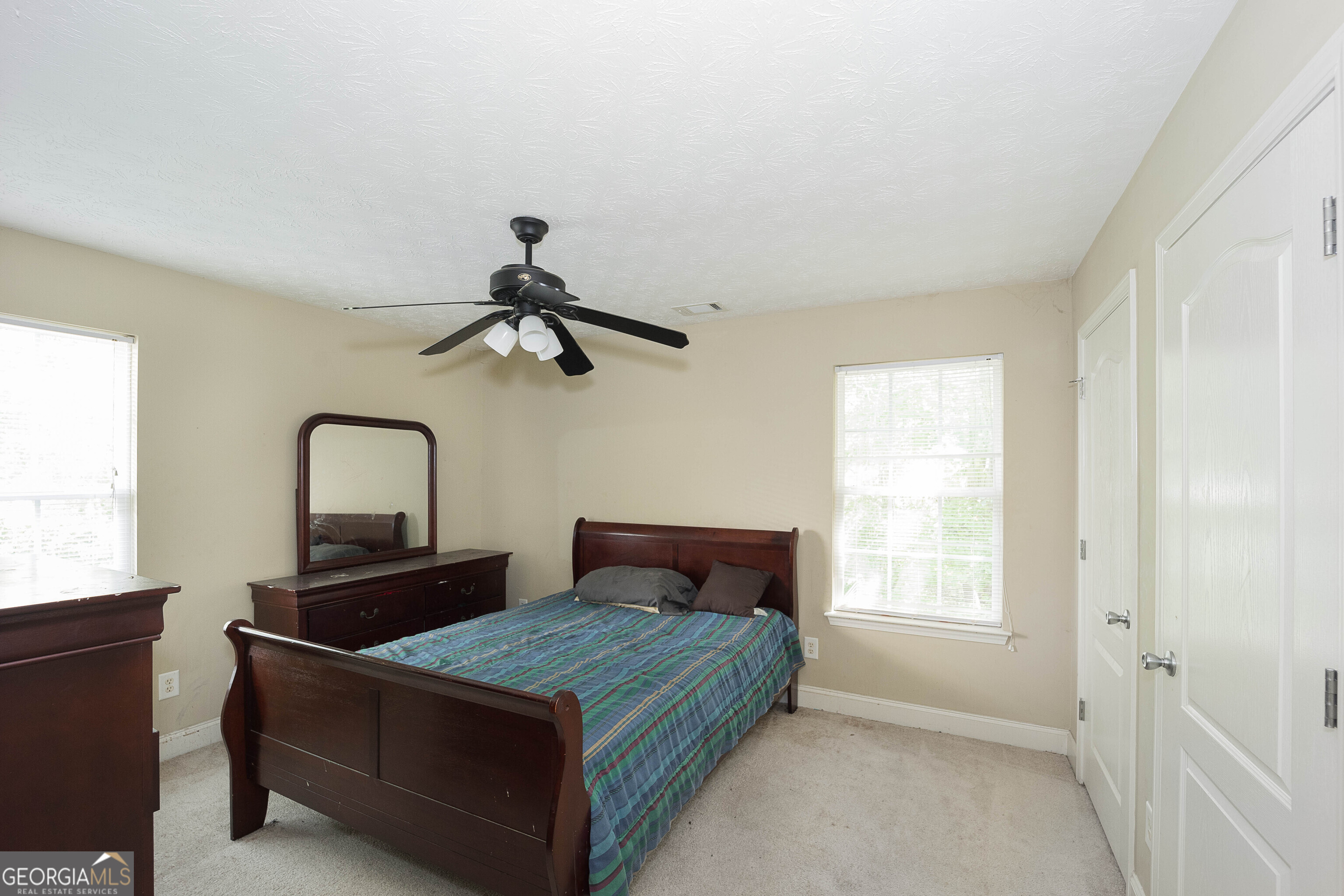 1231 Hillview Road Hampton, GA 30228 - Photo 26 of 45 a bedroom with a bed and window