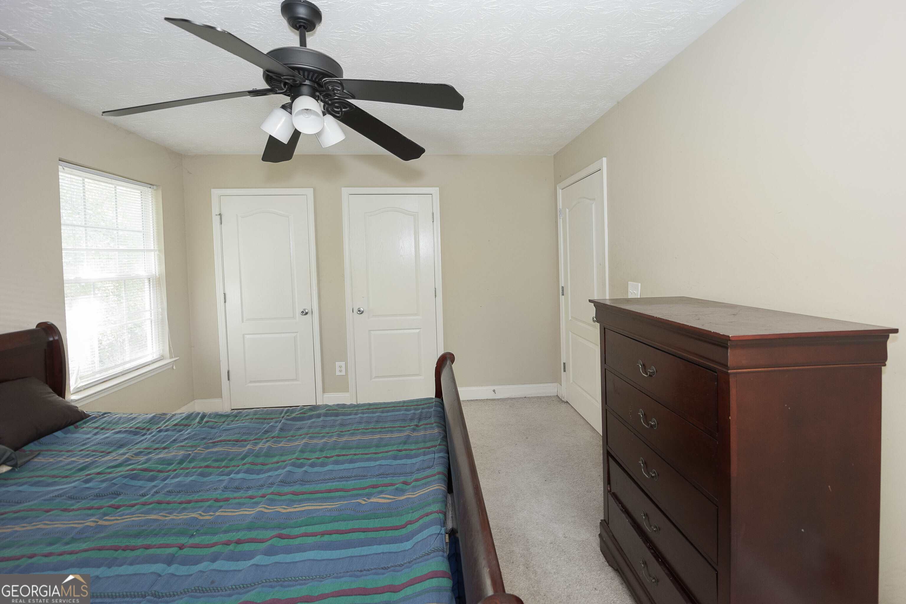 1231 Hillview Road Hampton, GA 30228 - Photo 28 of 45 a view of empty room with wooden floor and fan
