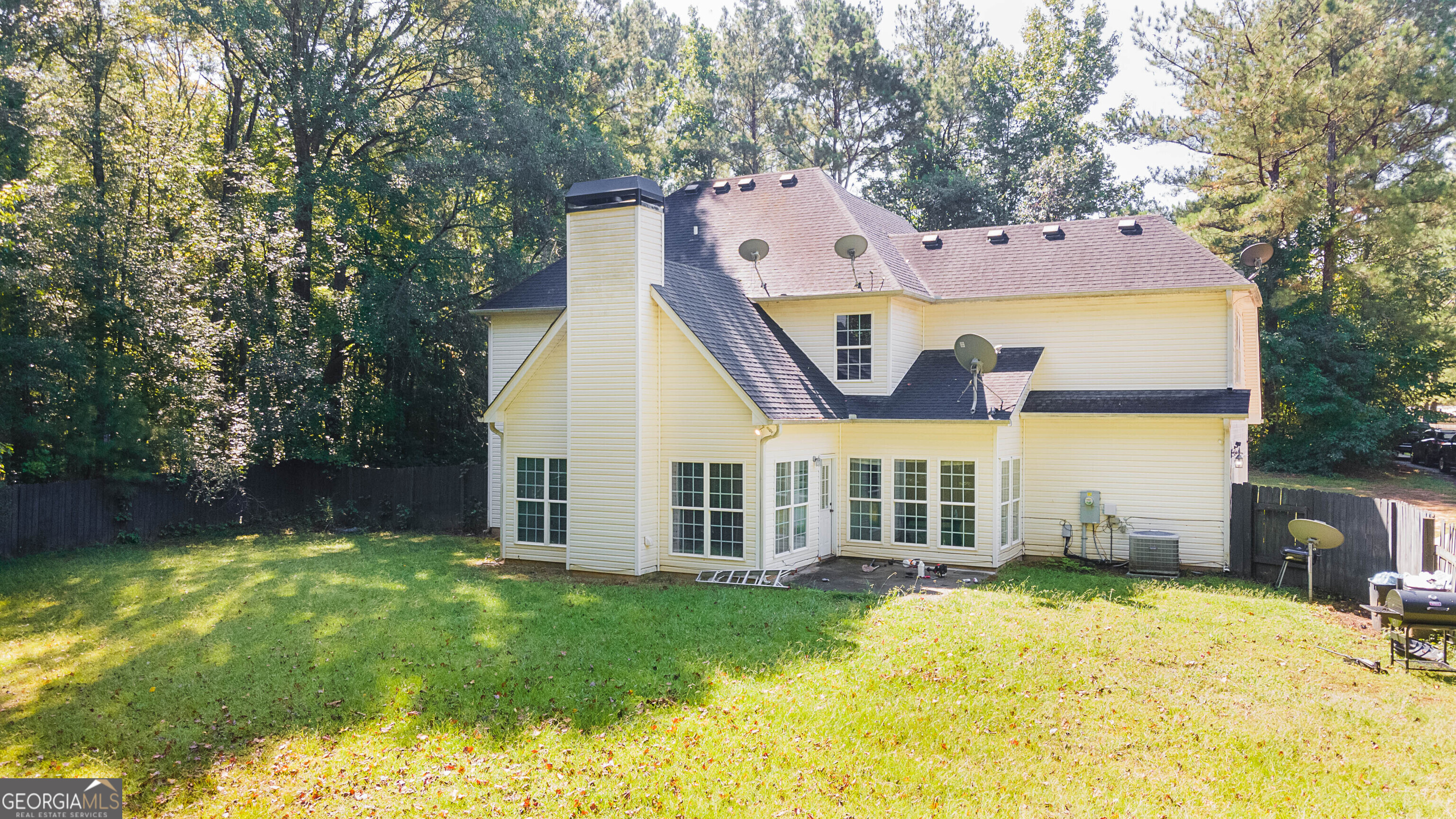 1231 Hillview Road Hampton, GA 30228 - Photo 40 of 45 a view of a house with a backyard and a tree