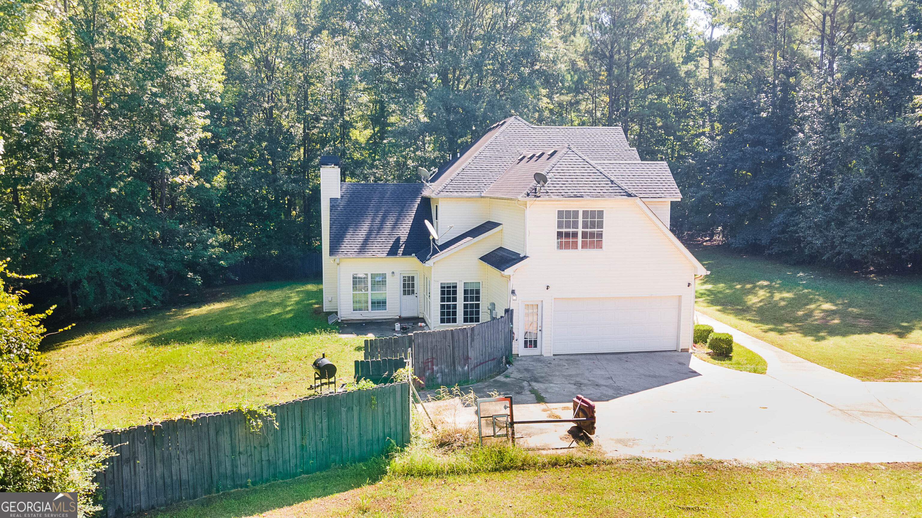 1231 Hillview Road Hampton, GA 30228 - Photo 41 of 45 an aerial view of a house with swimming pool and large trees