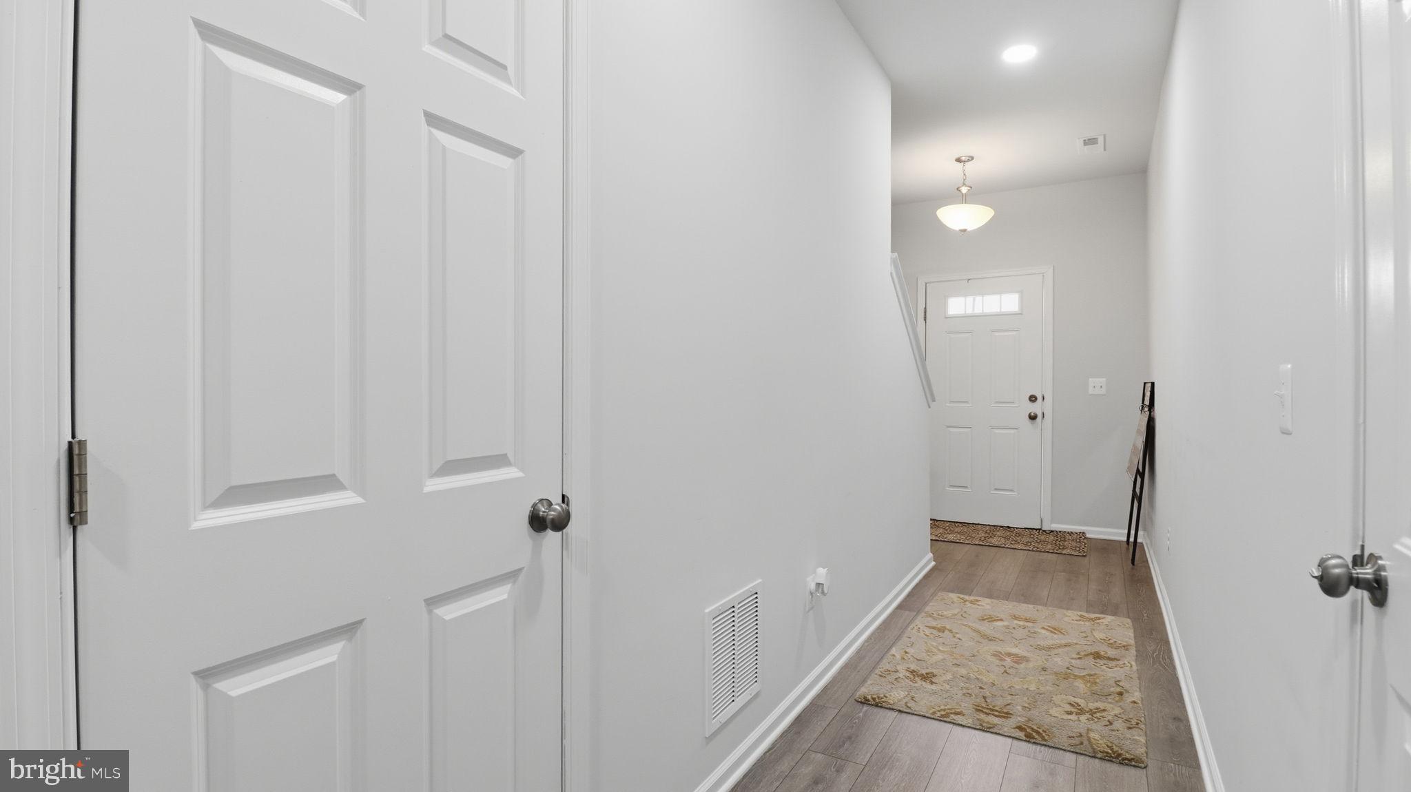 110 Edelweiss Way Stephenson, VA 22656 - Photo 7 of 45 Spacious entry hallway to bedroom & garage entry
