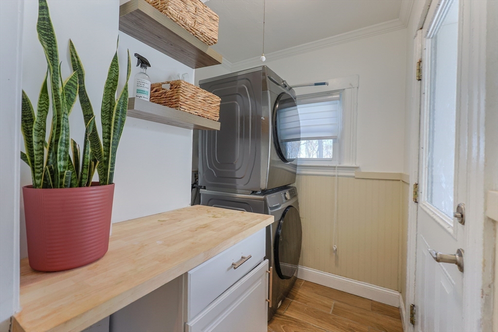 251 High Street Webster, MA 01570 - Photo 25 of 38 a room with an oven and potted plant