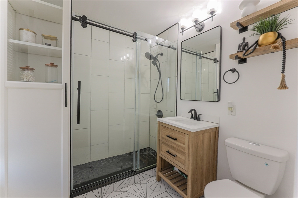 251 High Street Webster, MA 01570 - Photo 28 of 38 a bathroom with a sink toilet and shower