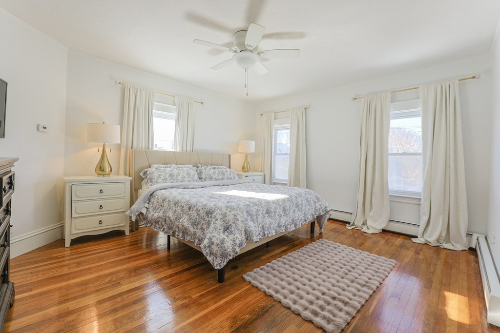 251 High Street Webster, MA 01570 - Photo 29 of 38 a bedroom with a bed and wooden floor