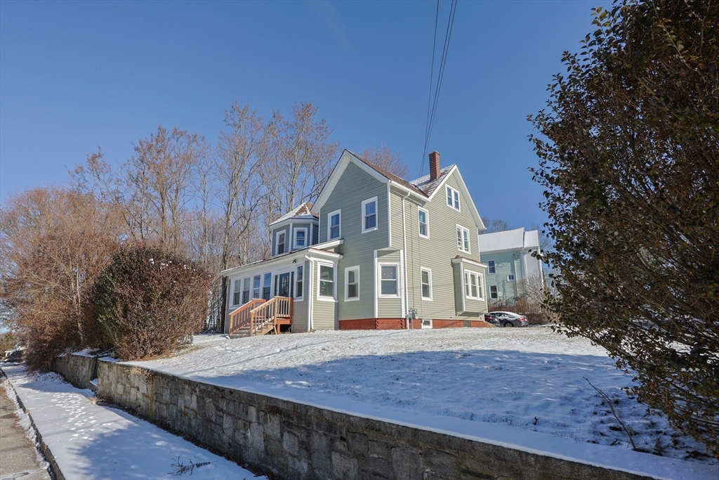 251 High Street Webster, MA 01570 - Photo 3 of 38 a front view of a house with a yard