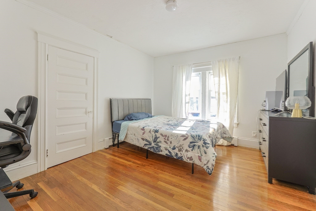 251 High Street Webster, MA 01570 - Photo 33 of 38 a bedroom with a bed and wooden floor