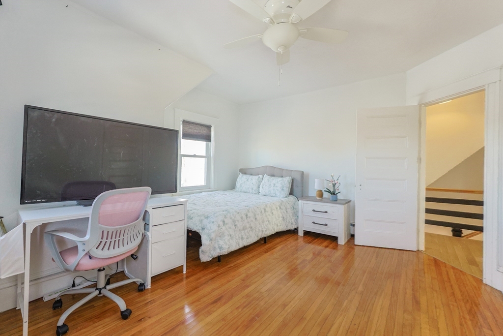 251 High Street Webster, MA 01570 - Photo 35 of 38 a bedroom with furniture and a wooden floor