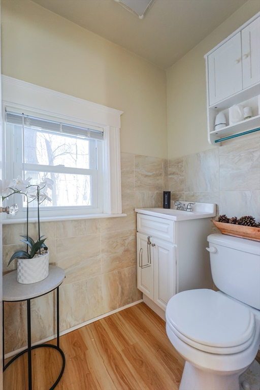 251 High Street Webster, MA 01570 - Photo 37 of 38 a bathroom with a toilet sink and mirror