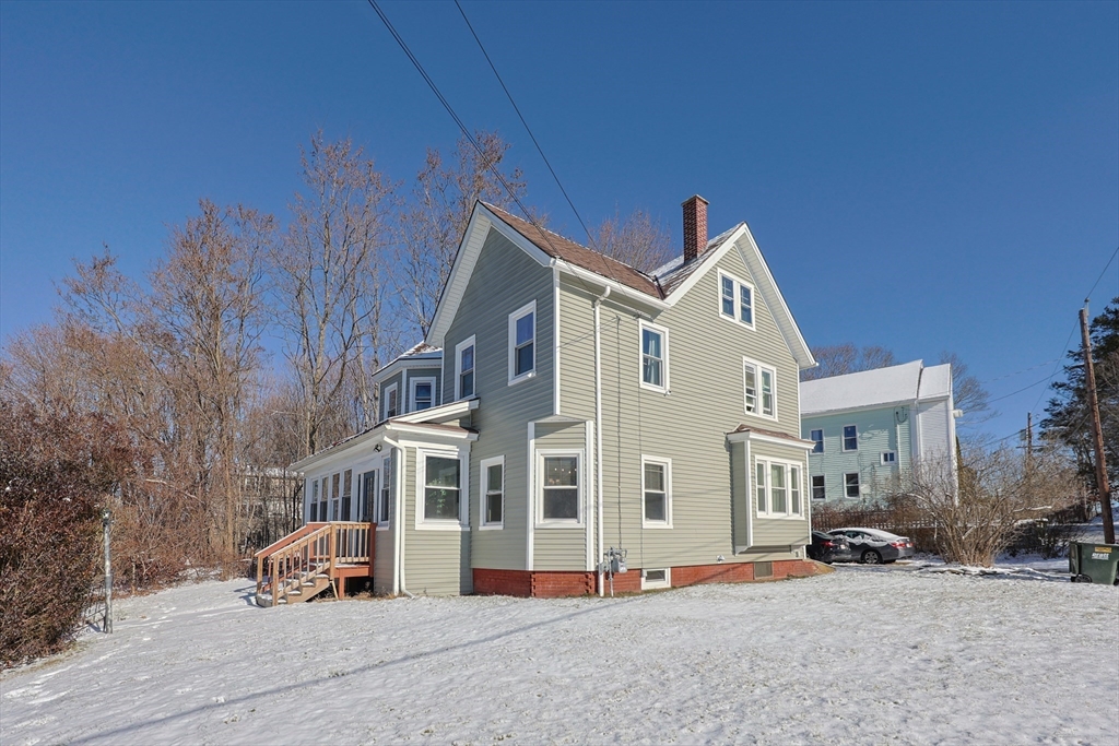 251 High Street Webster, MA 01570 - Photo 4 of 38 a front view of a house with a yard