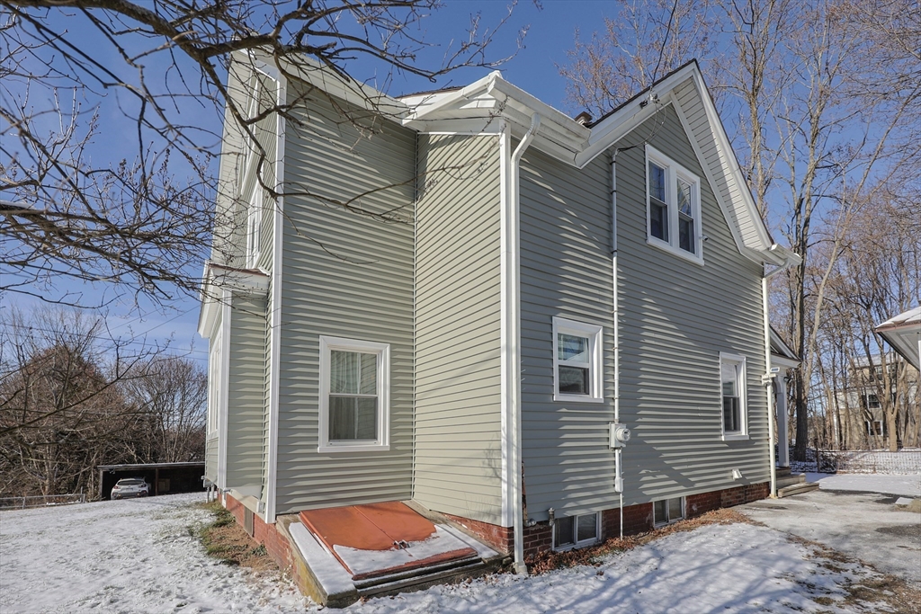 251 High Street Webster, MA 01570 - Photo 5 of 38 a front view of a house with a backyard