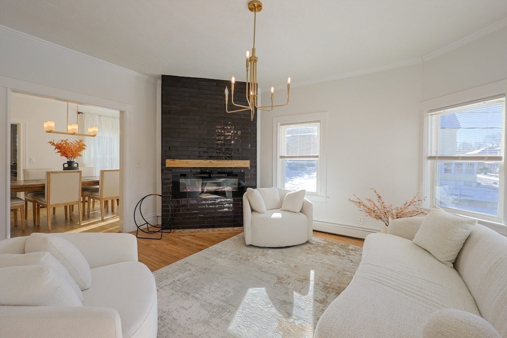 251 High Street Webster, MA 01570 - Photo 7 of 38 a living room with furniture and a fireplace