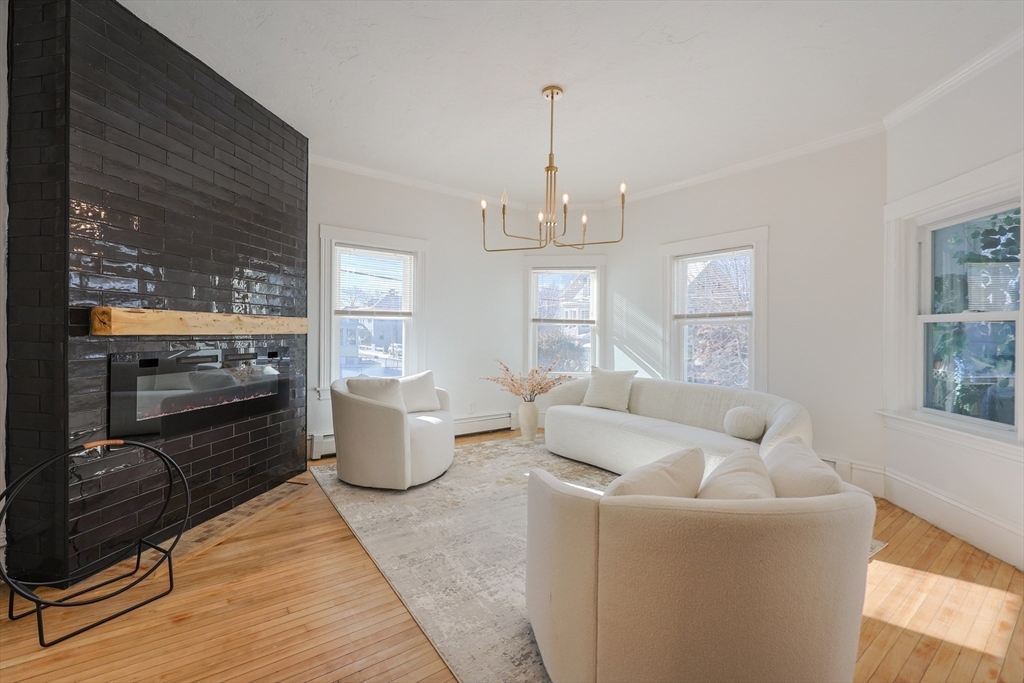 251 High Street Webster, MA 01570 - Photo 8 of 38 a living room with furniture and a flat screen tv