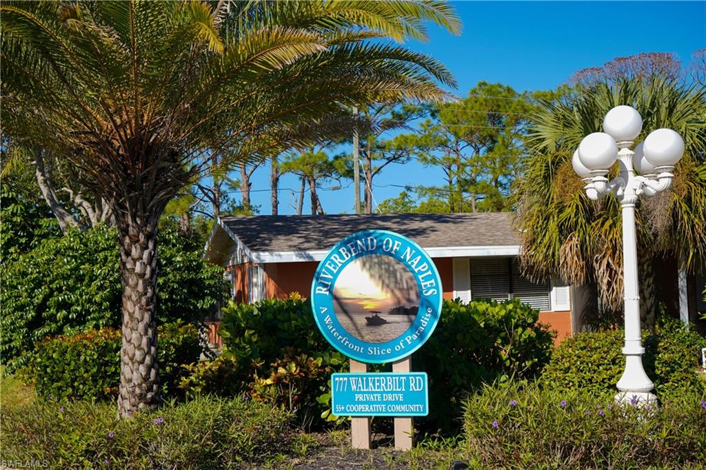 777 Walkerbilt Road Naples, FL 34110 - Photo 2 of 12 a view of a house with a swimming pool and outdoor seating