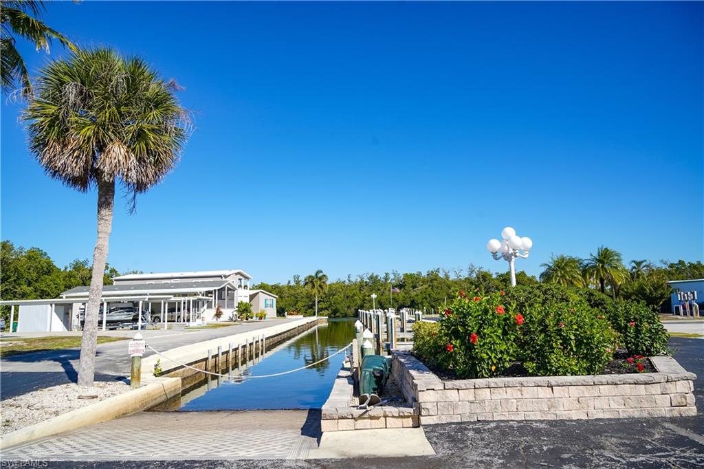 777 Walkerbilt Road Naples, FL 34110 - Photo 6 of 12 a view of a balcony with potted plants