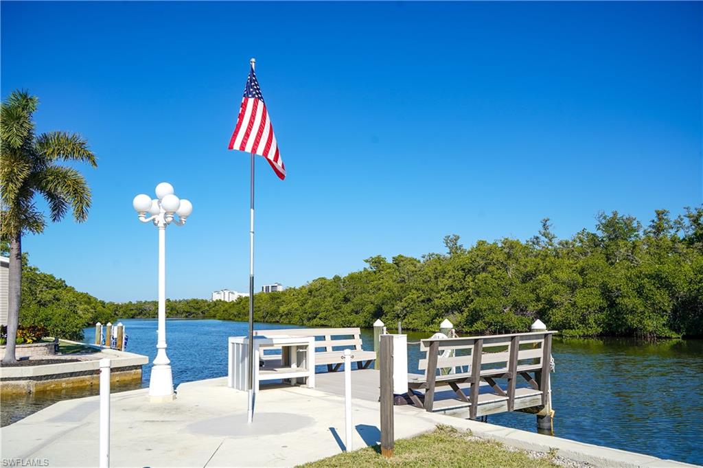 777 Walkerbilt Road Naples, FL 34110 - Photo 7 of 12 a view of a patio with chairs and potted plants