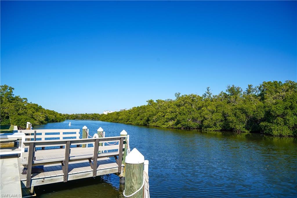 777 Walkerbilt Road Naples, FL 34110 - Photo 8 of 12 a view of a lake with houses