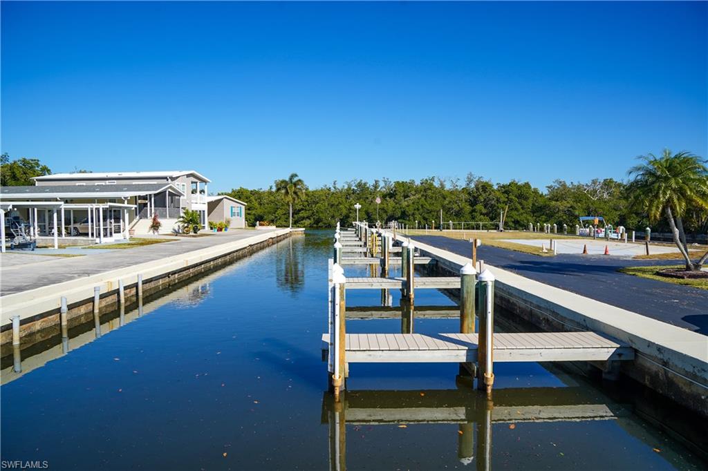 777 Walkerbilt Road Naples, FL 34110 - Photo 10 of 12 a view of a balcony with lake view and mountain view