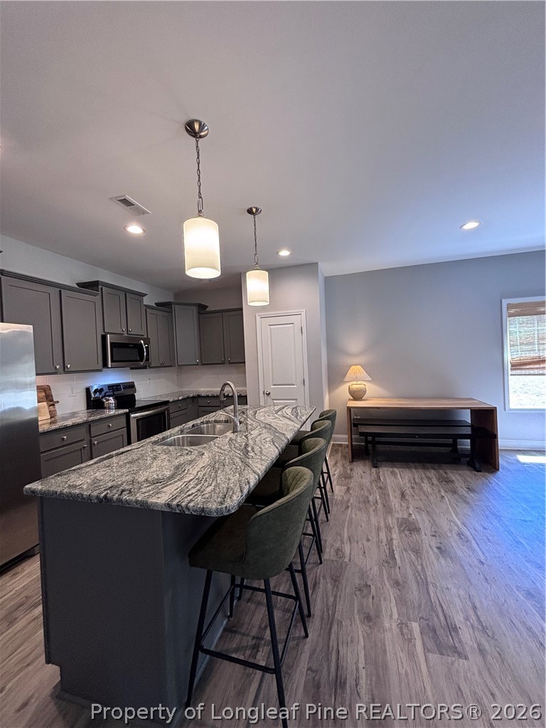 7720 Rufus Johnson Road Fayetteville, NC 28306 - Photo 20 of 50 a kitchen with sink table and chairs