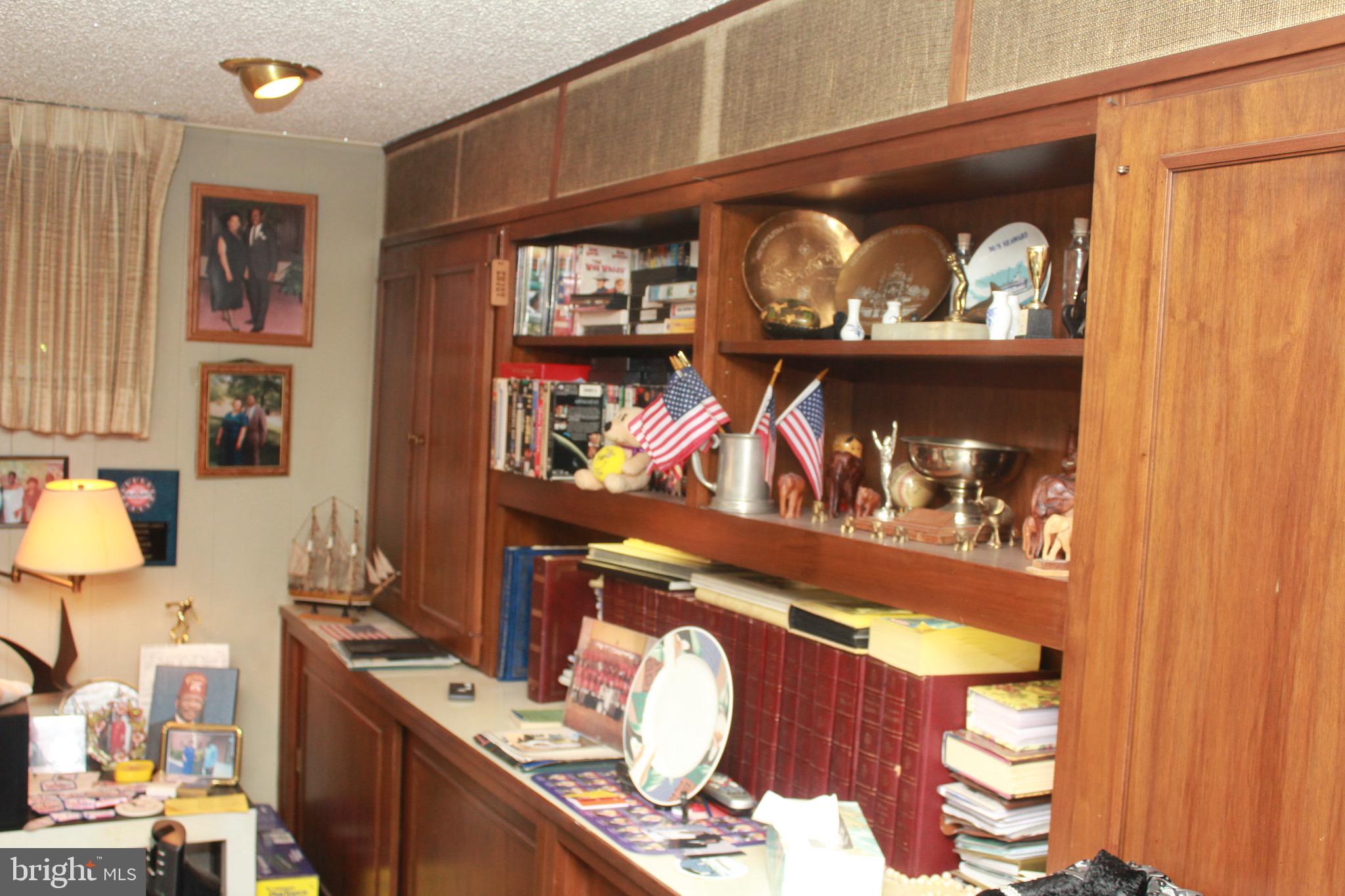 8301 Cobden Road Glenside, PA 19038 - Photo 27 of 32 built in shelving in finished basement