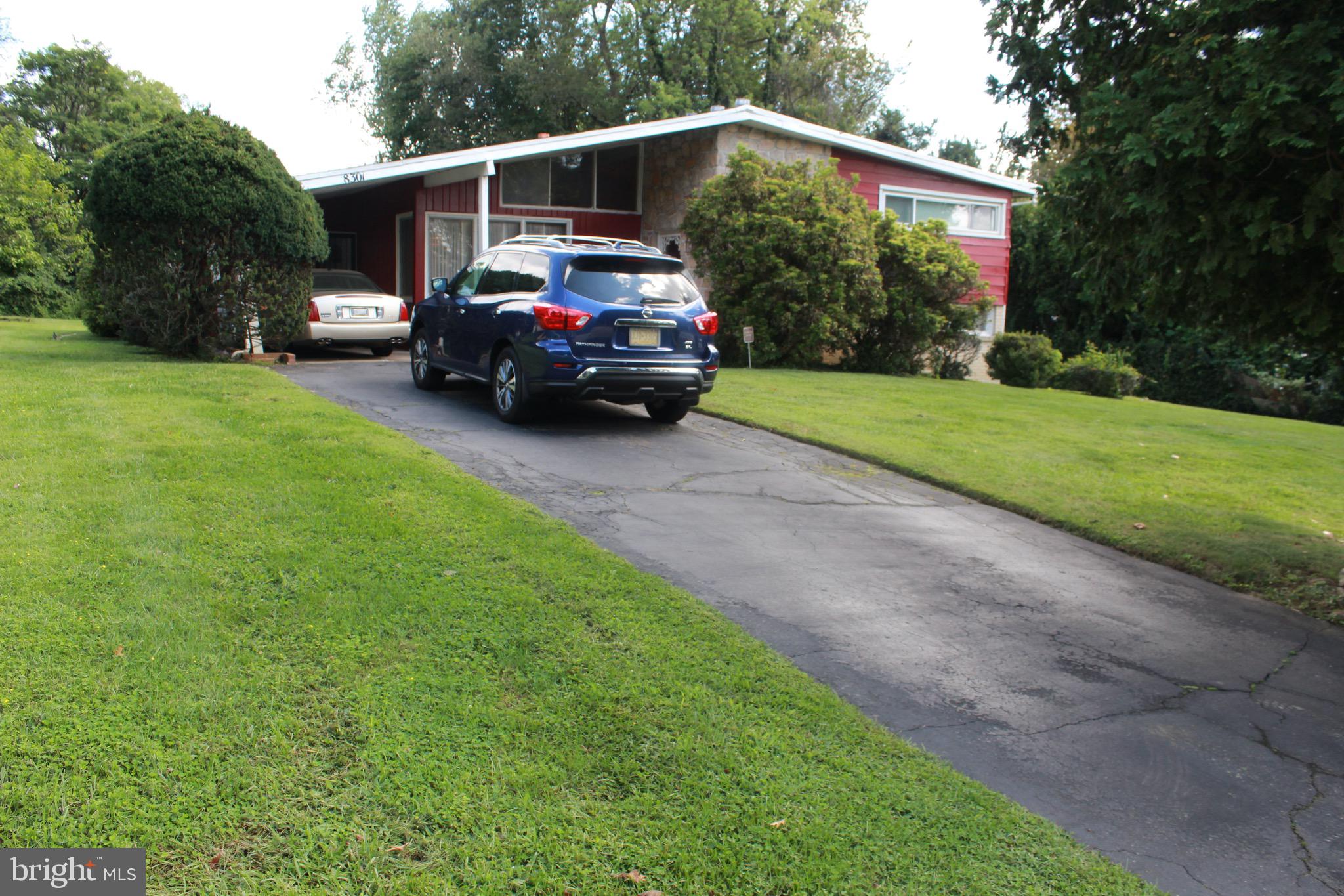 8301 Cobden Road Glenside, PA 19038 - Photo 5 of 32 long driveway with carport