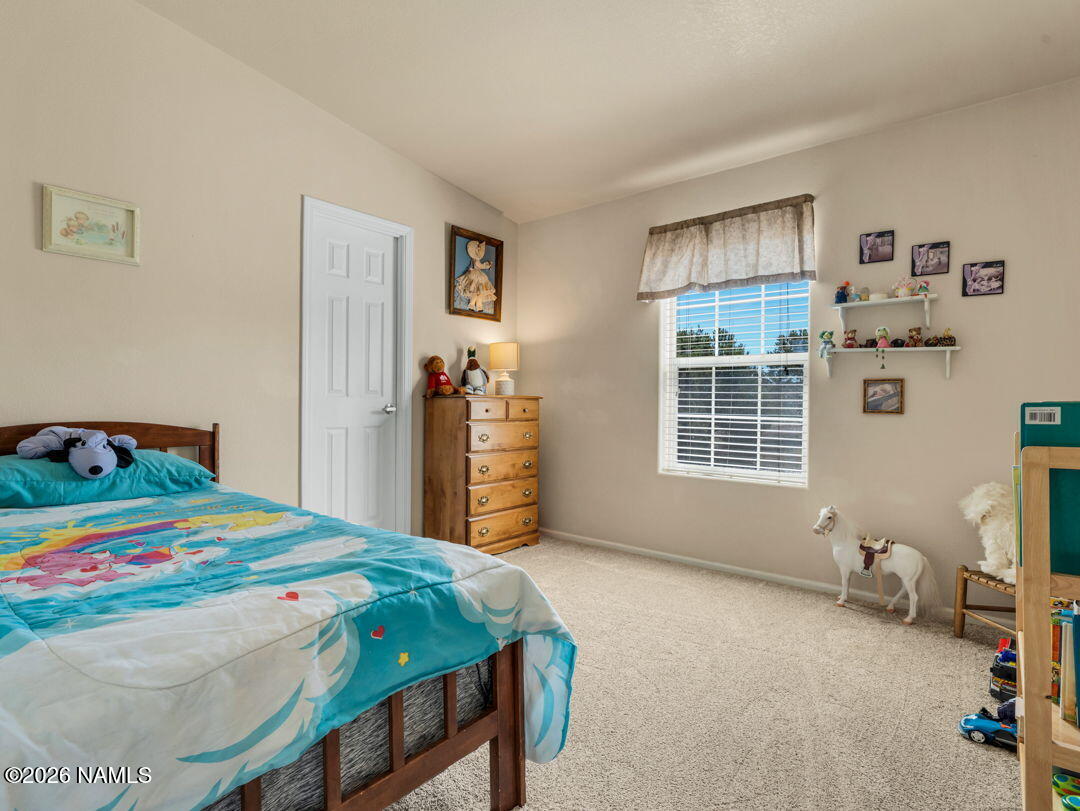7538 Iron Buffalo Road Williams, AZ 86046 - Photo 18 of 30 a bedroom with a bed and a window