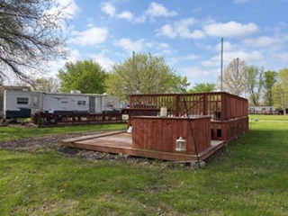 a view of a backyard with wooden fence