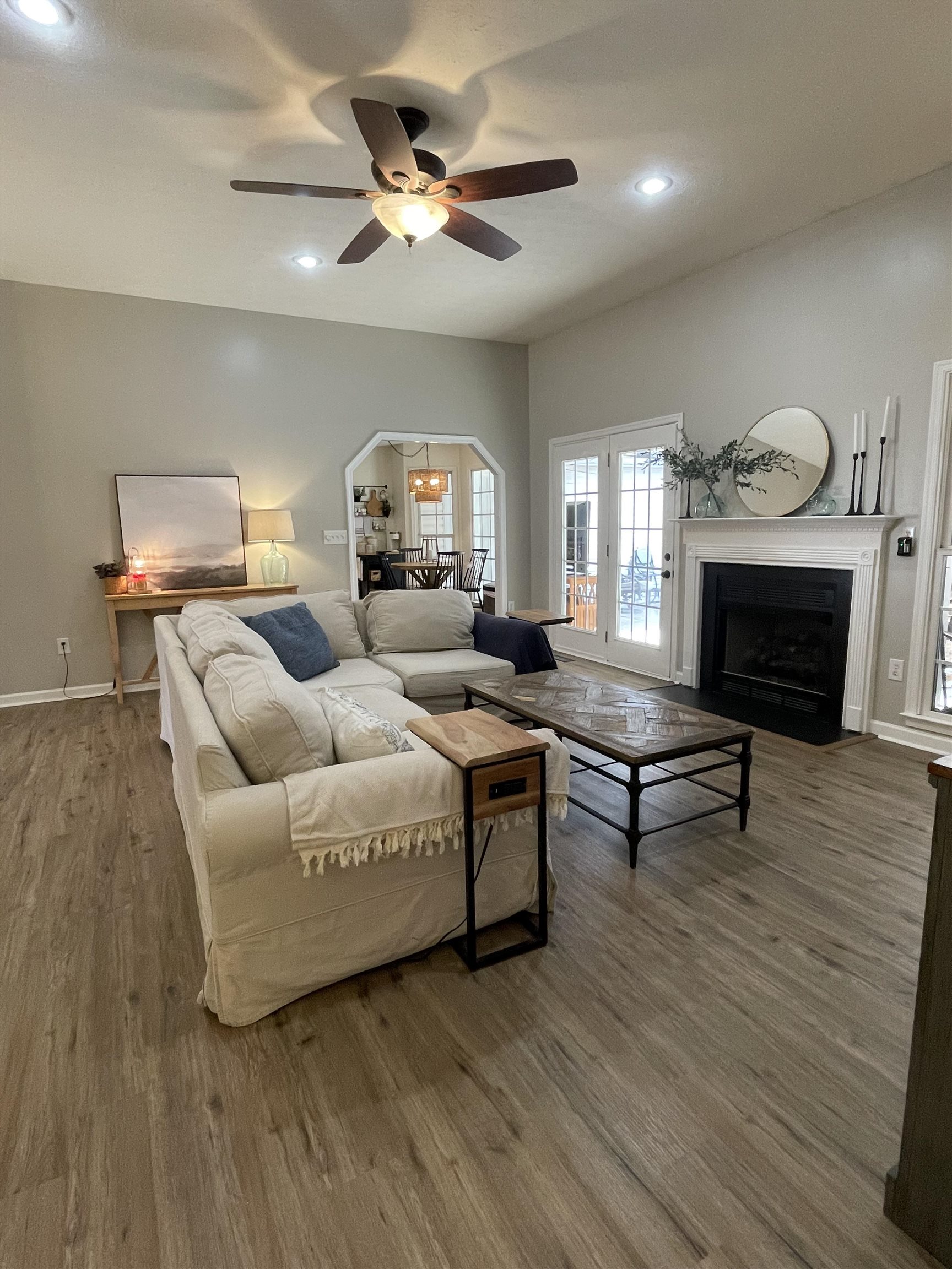 111 Rutherford Lane Stuarts Draft, VA 24477 - Photo 12 of 45 a living room with furniture a fireplace and a ceiling fan