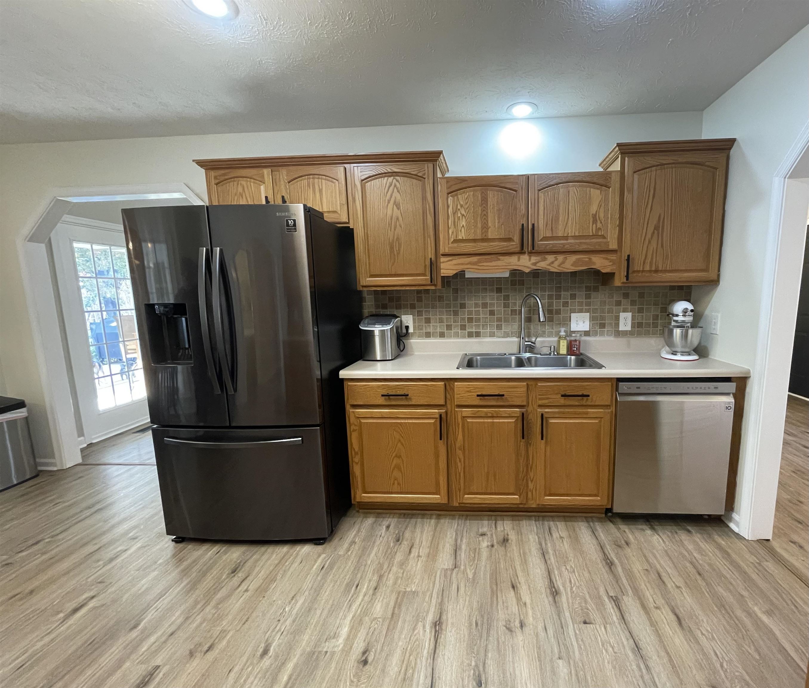 111 Rutherford Lane Stuarts Draft, VA 24477 - Photo 17 of 45 a kitchen with a refrigerator sink and cabinets