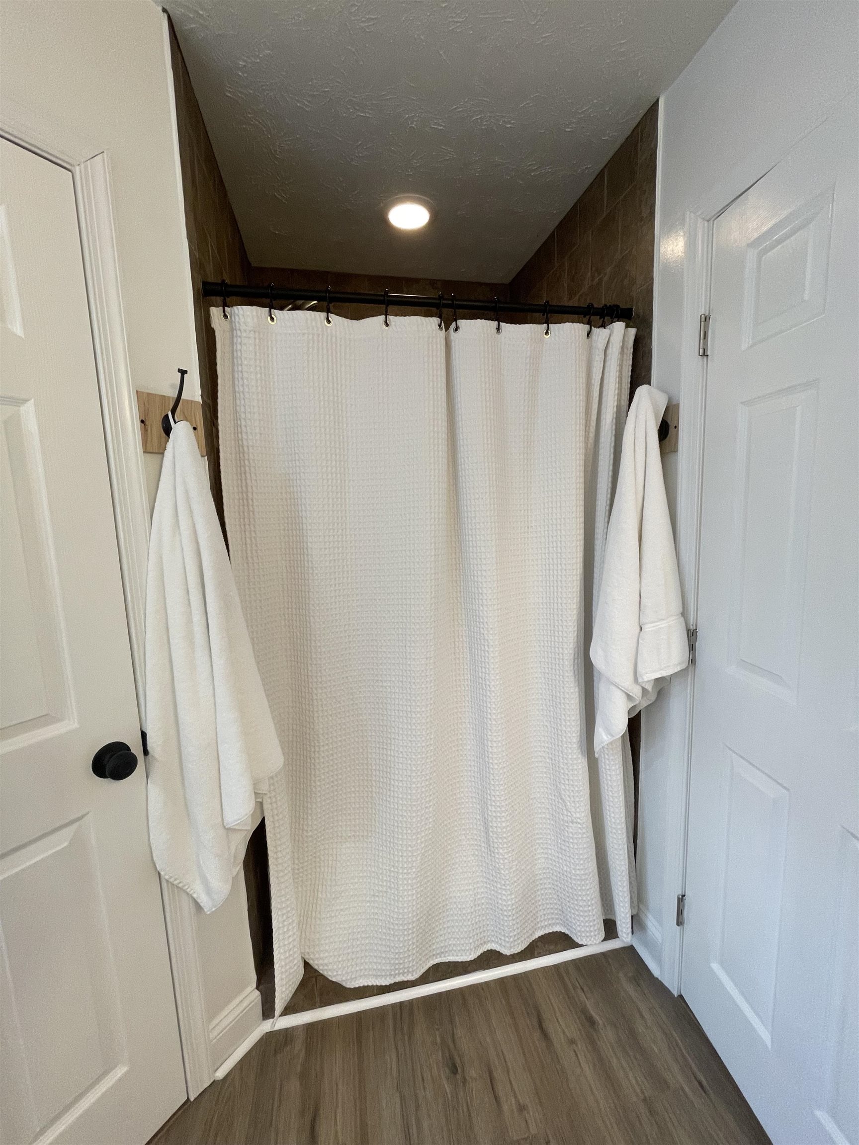 111 Rutherford Lane Stuarts Draft, VA 24477 - Photo 26 of 45 a view of walk in closet with wooden floor