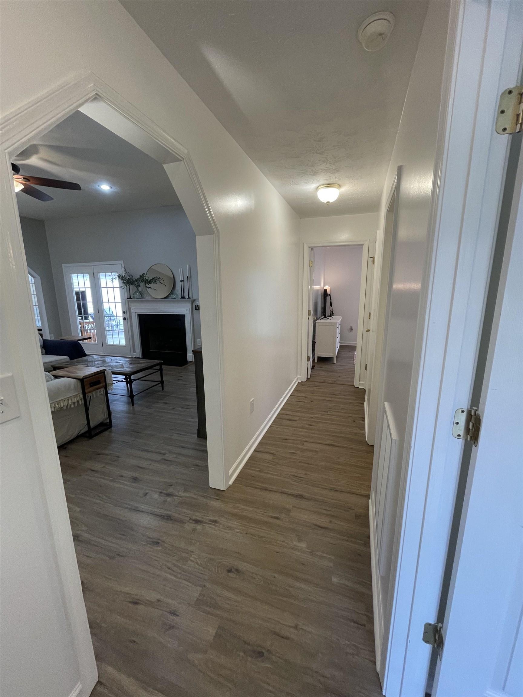 111 Rutherford Lane Stuarts Draft, VA 24477 - Photo 30 of 45 a view of a hallway with wooden floor fireplace and living room