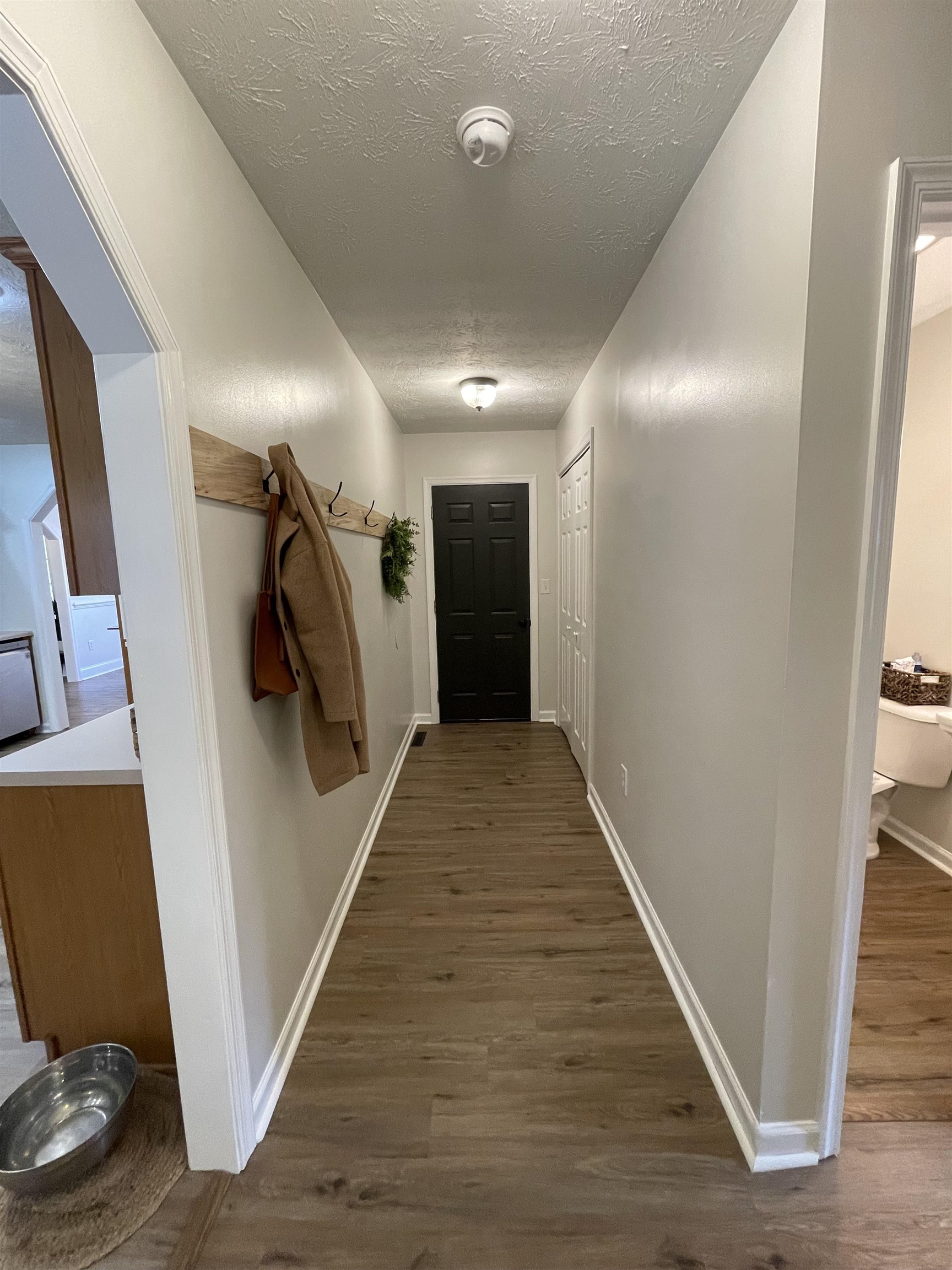 111 Rutherford Lane Stuarts Draft, VA 24477 - Photo 33 of 45 a view of a hallway with wooden floor and stairs