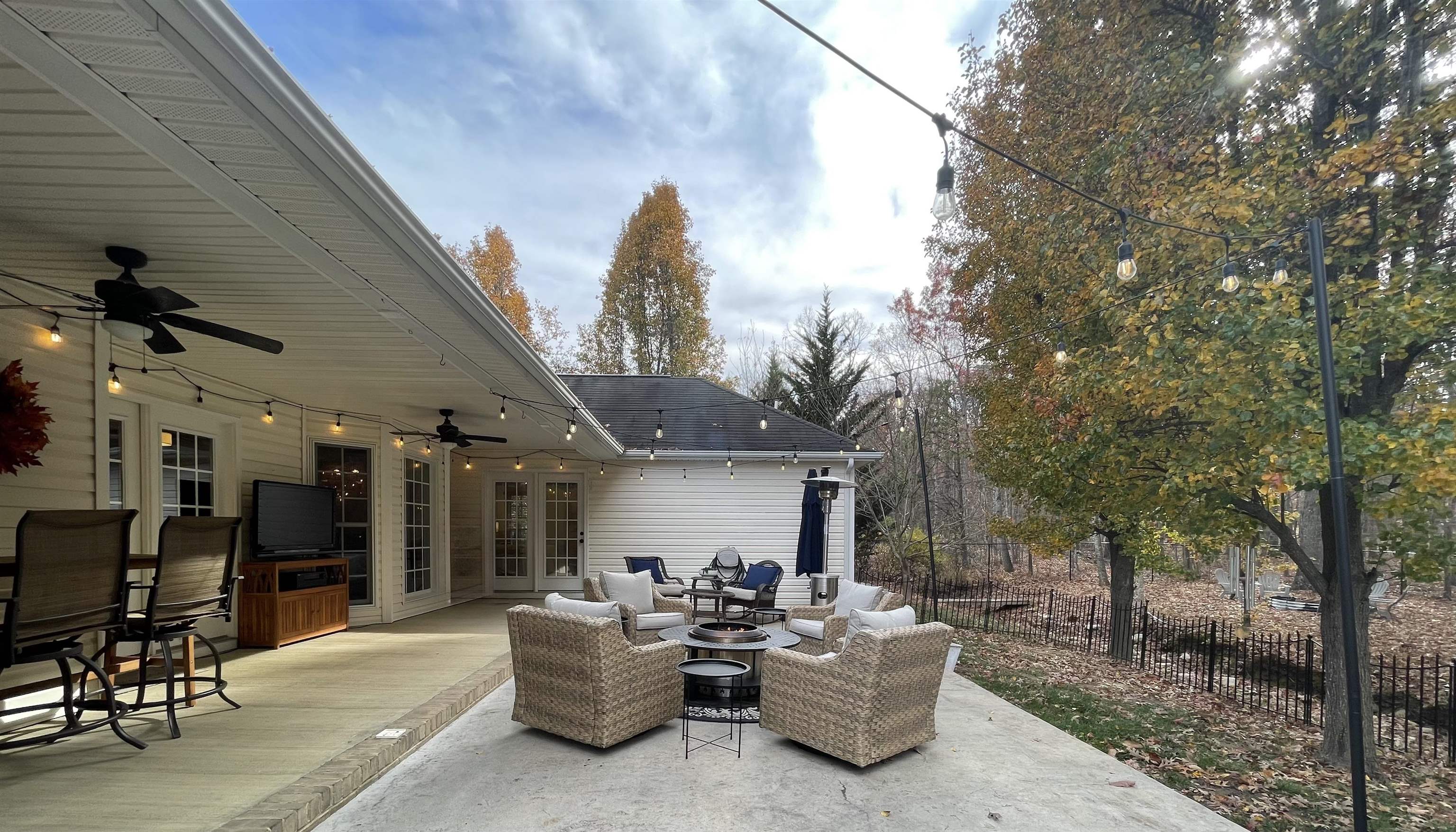 111 Rutherford Lane Stuarts Draft, VA 24477 - Photo 38 of 45 a view of the patio with couches table and chairs and potted plants
