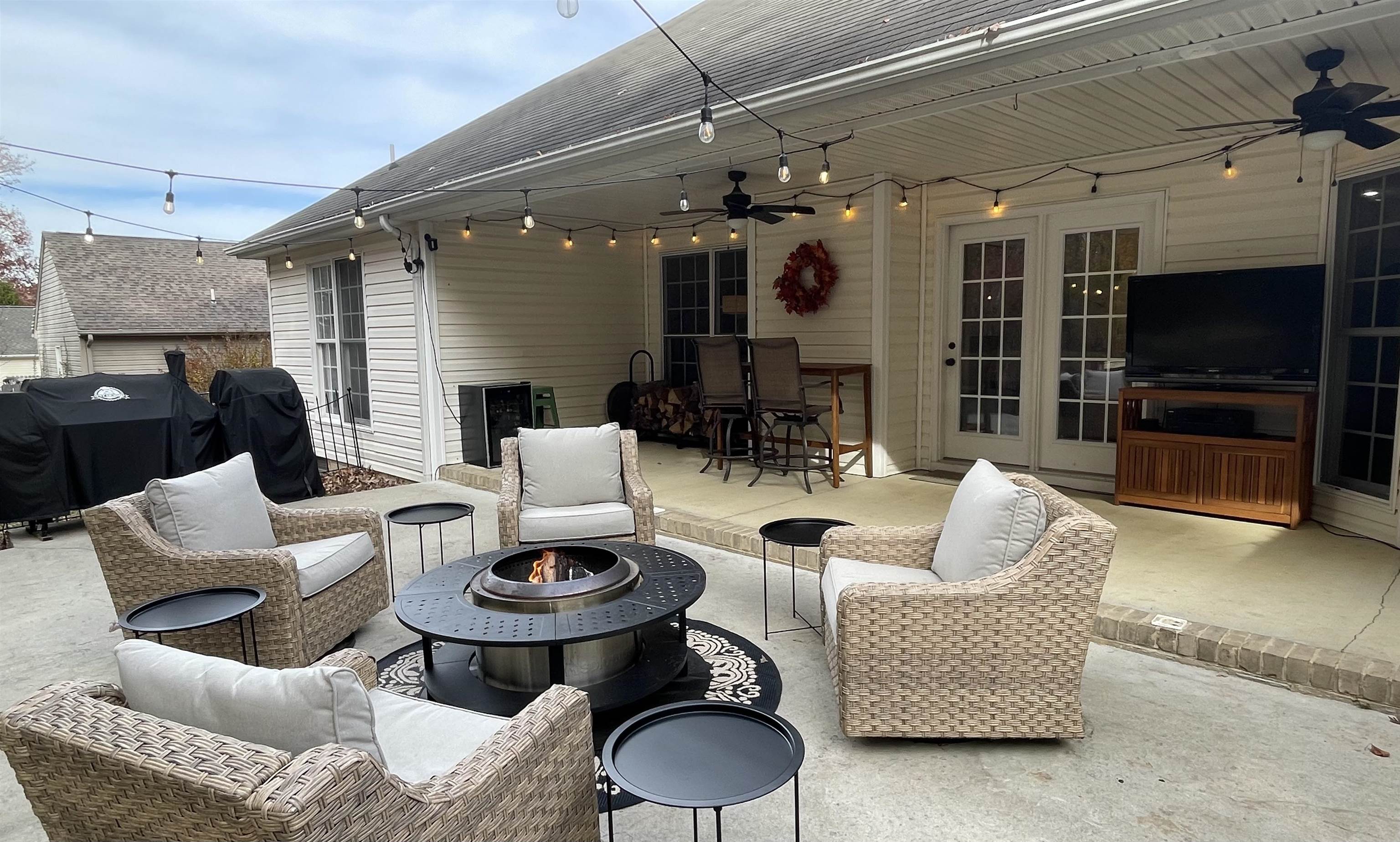 111 Rutherford Lane Stuarts Draft, VA 24477 - Photo 39 of 45 a living room with furniture a flat screen tv and a fireplace