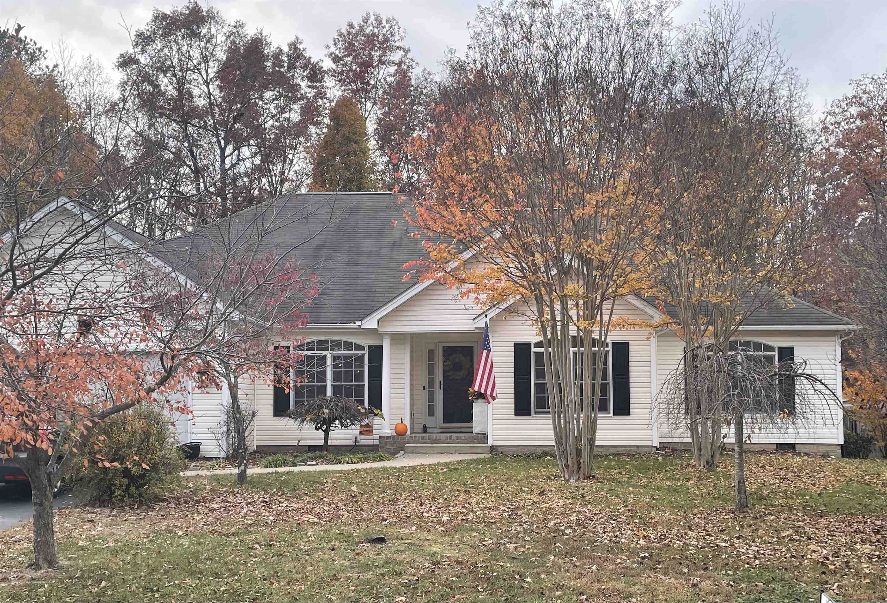 111 Rutherford Lane Stuarts Draft, VA 24477 - Photo 5 of 45 a front view of a house with a yard and large tree