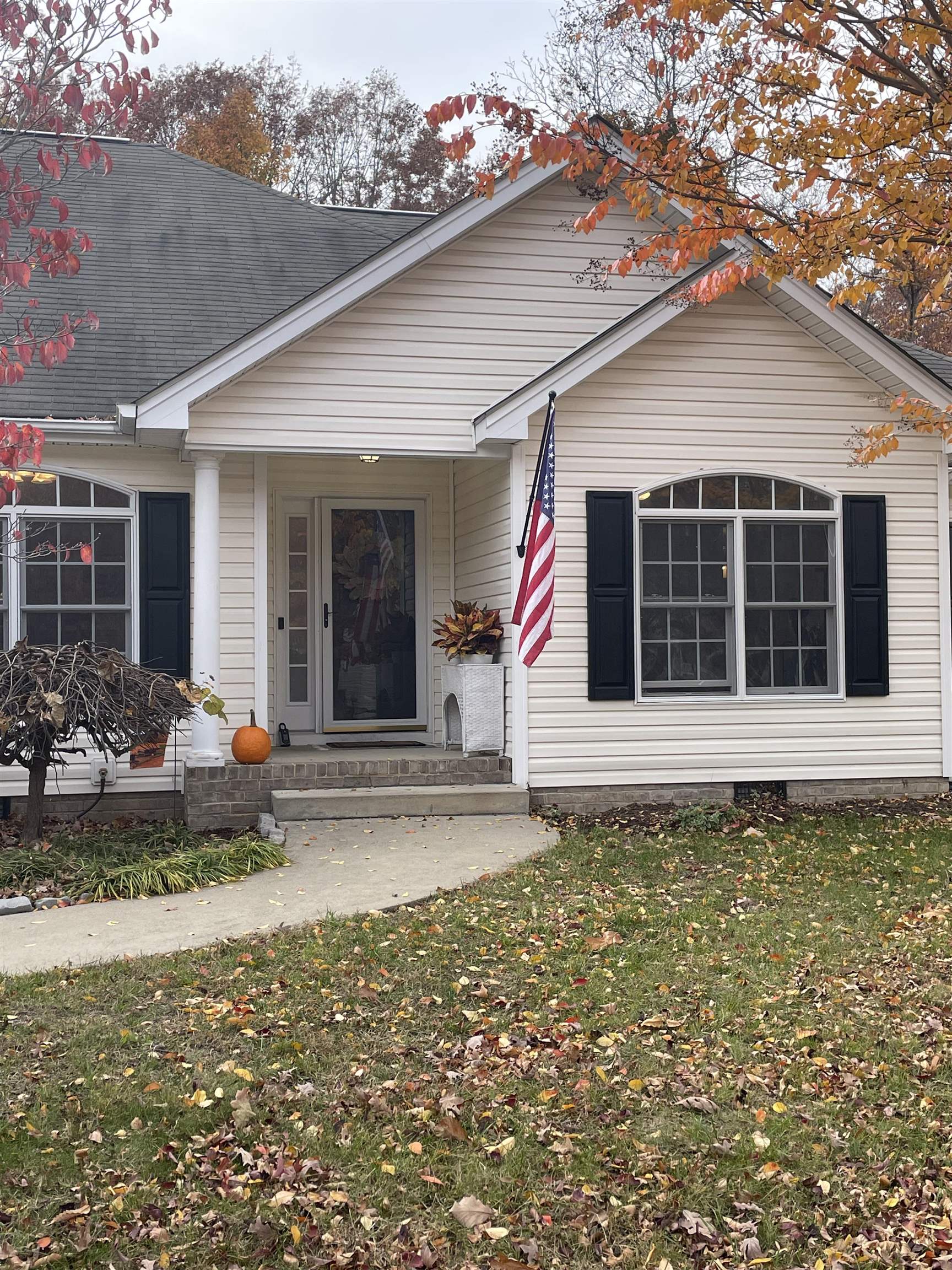 111 Rutherford Lane Stuarts Draft, VA 24477 - Photo 6 of 45 a view of a house with a small yard and a large tree