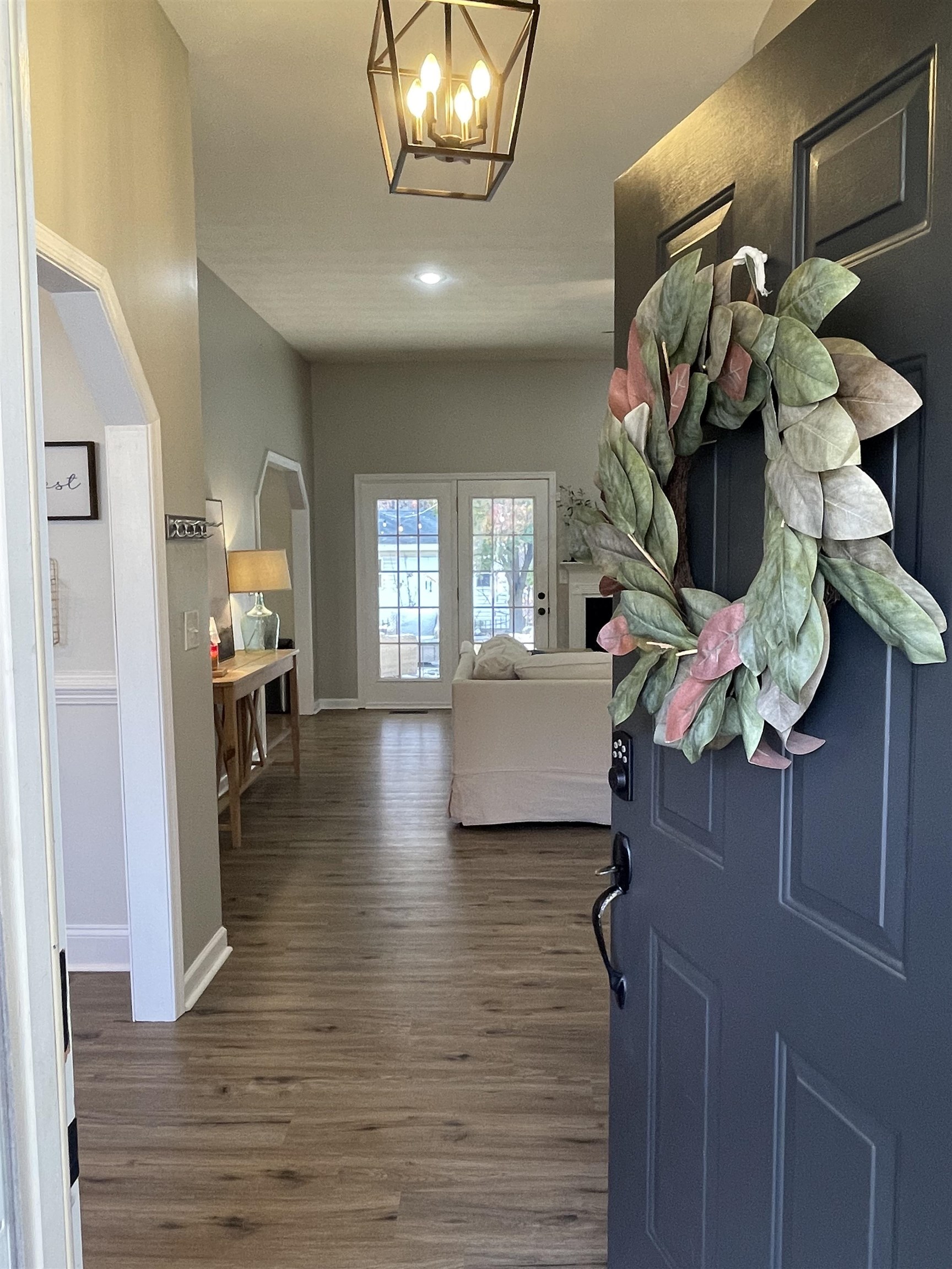 111 Rutherford Lane Stuarts Draft, VA 24477 - Photo 7 of 45 a living room with furniture and a chandelier
