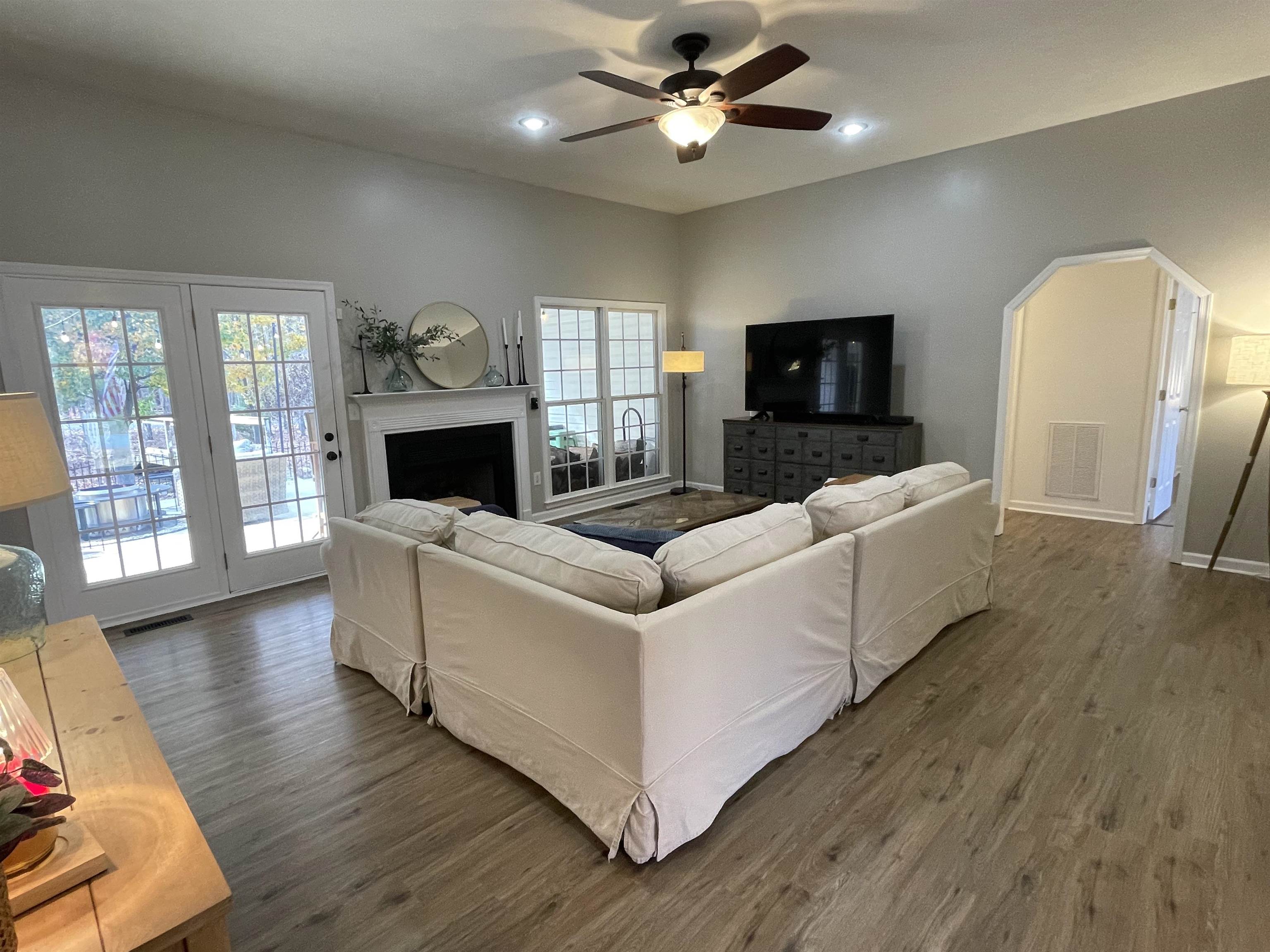 111 Rutherford Lane Stuarts Draft, VA 24477 - Photo 9 of 45 a living room with furniture a fireplace and a flat screen tv