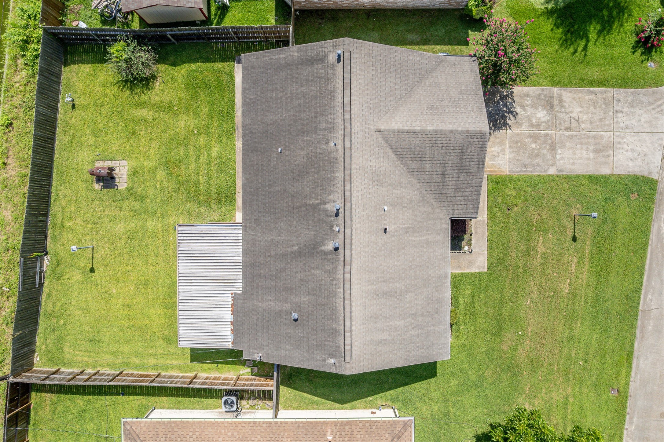 206 Kelly Lane Baytown, TX 77521 - Photo 34 of 38 The backyard is spacious. Perfect for outdoor gatherings or pets.