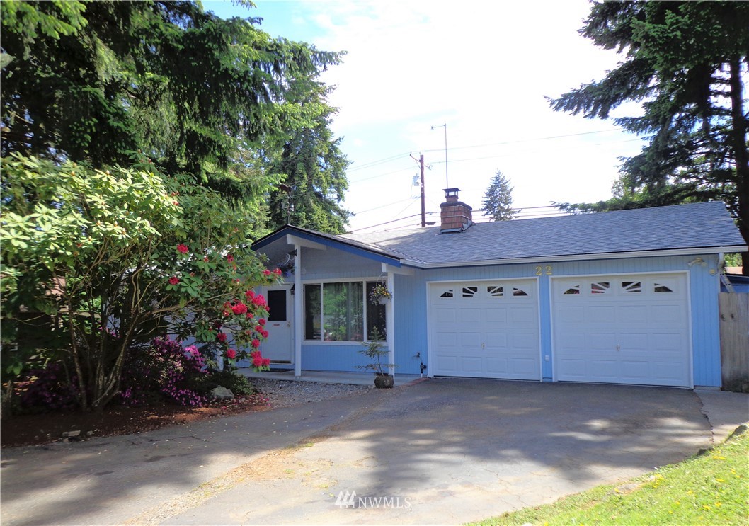22 223rd Street Southwest Bothell, WA 98021 - Photo 1 of 1 a view of a house with a backyard and garage