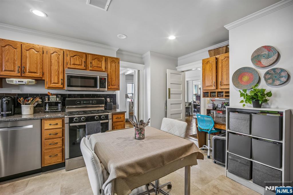 57 Union Street, Unit C4021 Montclair, NJ 07042 - Photo 13 of 20 a kitchen with stainless steel appliances a stove refrigerator sink and cabinets